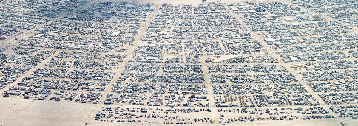 This aerial photograph of Black Rock City was shot on the morning of Friday August 31st, 2018 during Burning Man 2018. The pilot of the aircraft was Purple Haze.