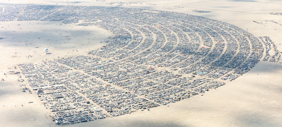 This aerial photograph of Black Rock City was shot on the morning of Friday August 31st, 2018 during Burning Man 2018. The pilot of the aircraft was Purple Haze.