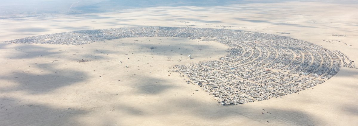 This aerial photograph of Black Rock City was shot on the morning of Friday August 31st, 2018 during Burning Man 2018. The pilot of the aircraft was Purple Haze.