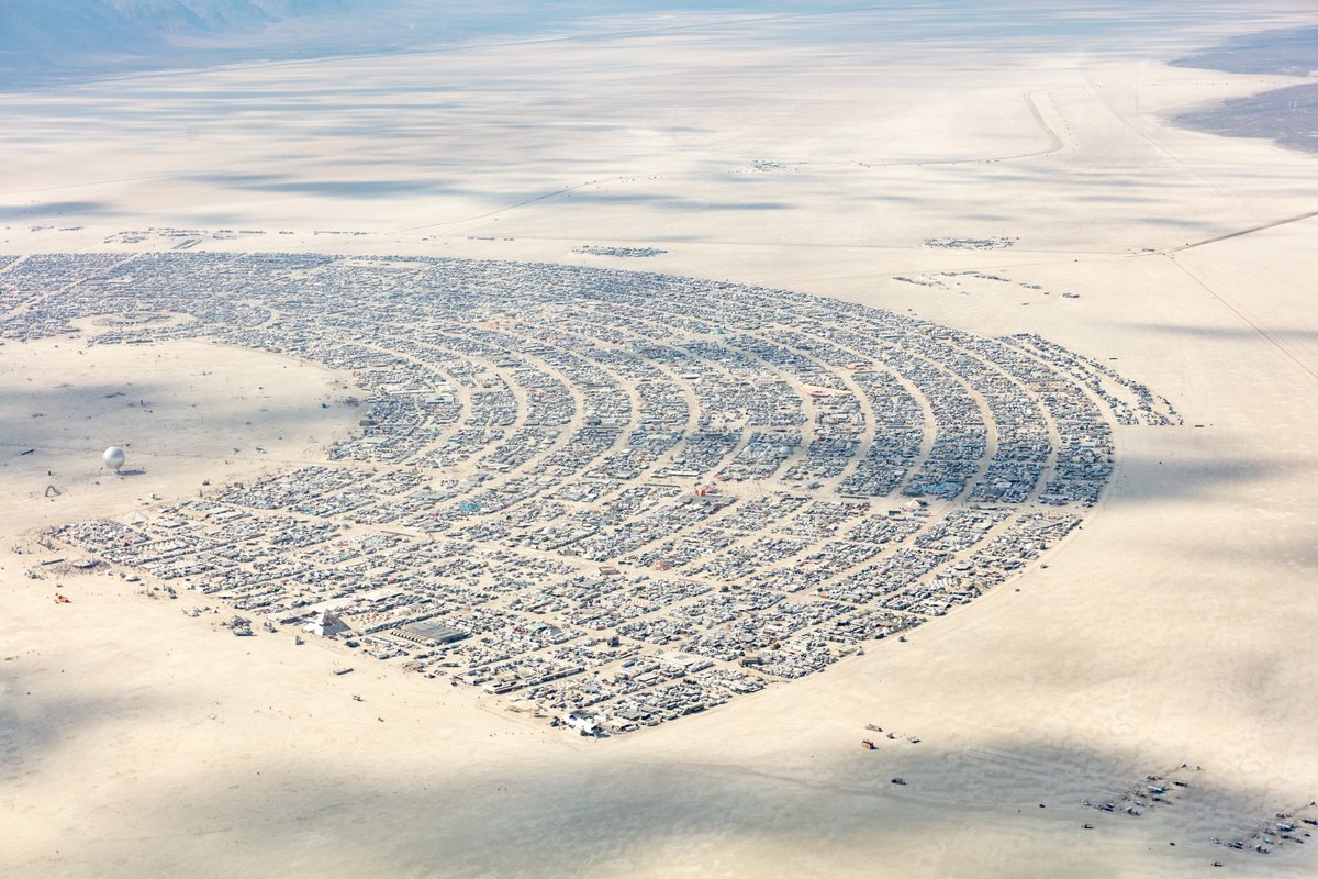 This aerial photograph of Black Rock City was shot on the morning of Friday August 31st, 2018 during Burning Man 2018. The pilot of the aircraft was Purple Haze.