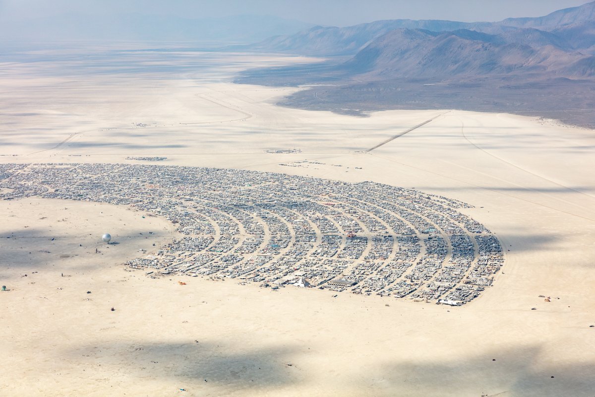This aerial photograph of Black Rock City was shot on the morning of Friday August 31st, 2018 during Burning Man 2018. The pilot of the aircraft was Purple Haze.