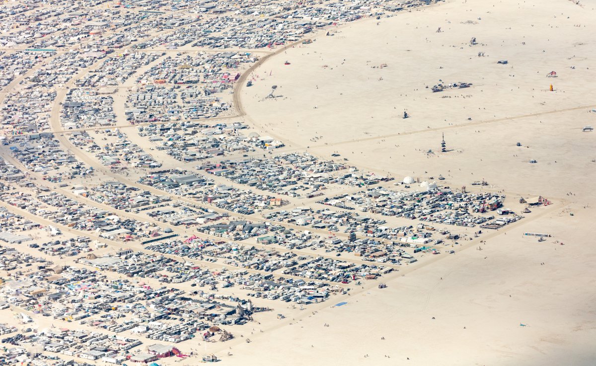 This aerial photograph of Black Rock City was shot on the morning of Friday August 31st, 2018 during Burning Man 2018. The pilot of the aircraft was Purple Haze.