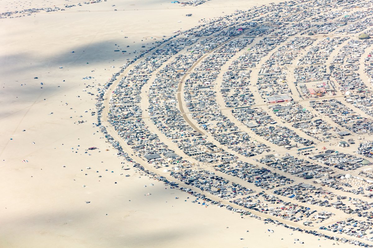 This aerial photograph of Black Rock City was shot on the morning of Friday August 31st, 2018 during Burning Man 2018. The pilot of the aircraft was Purple Haze.