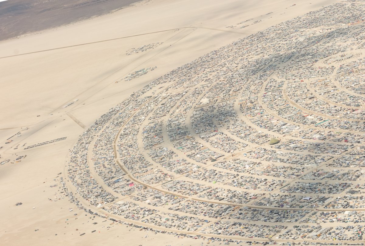 This aerial photograph of Black Rock City was shot on the morning of Friday August 31st, 2018 during Burning Man 2018. The pilot of the aircraft was Purple Haze.