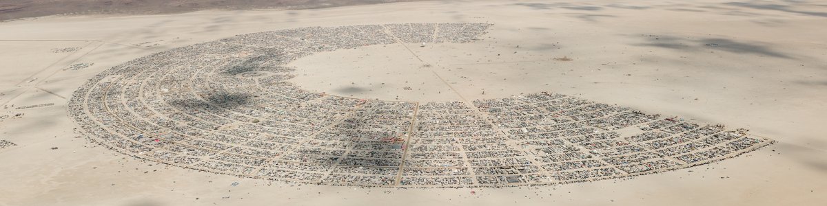 This aerial photograph of Black Rock City was shot on the morning of Friday August 31st, 2018 during Burning Man 2018. The pilot of the aircraft was Purple Haze. This image is about 115 Megapixels.