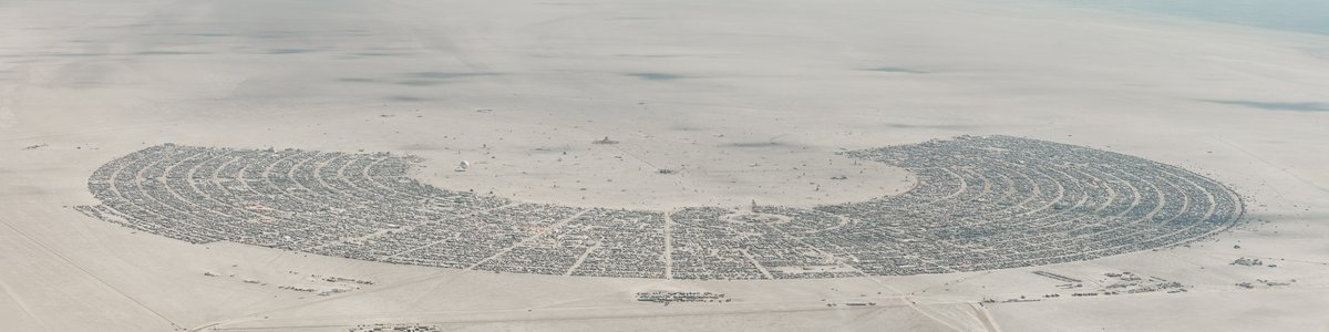 This aerial photograph of Black Rock City was shot on the morning of Friday August 31st, 2018 during Burning Man 2018. The pilot of the aircraft was Purple Haze.