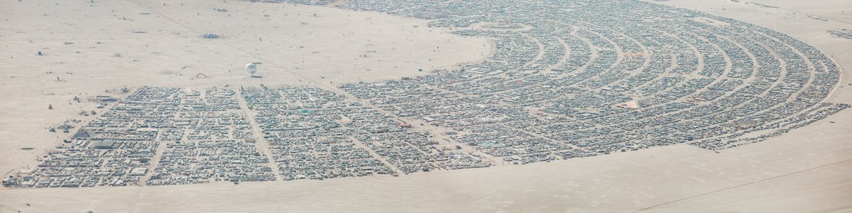 This aerial photograph of Black Rock City was shot on the morning of Friday August 31st, 2018 during Burning Man 2018. The pilot of the aircraft was Purple Haze.