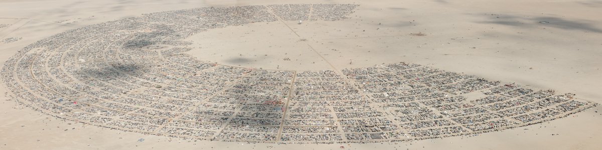 This aerial photograph of Black Rock City was shot on the morning of Friday August 31st, 2018 during Burning Man 2018. The pilot of the aircraft was Purple Haze.