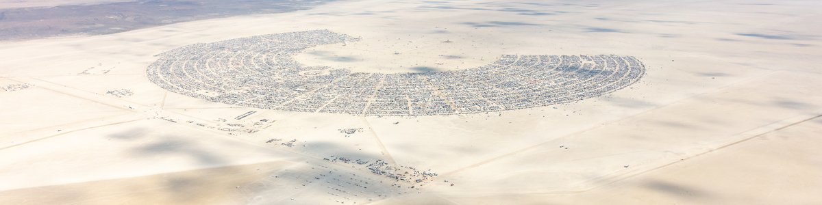 This aerial photograph of Black Rock City was shot on the morning of Friday August 31st, 2018 during Burning Man 2018. The pilot of the aircraft was Purple Haze.