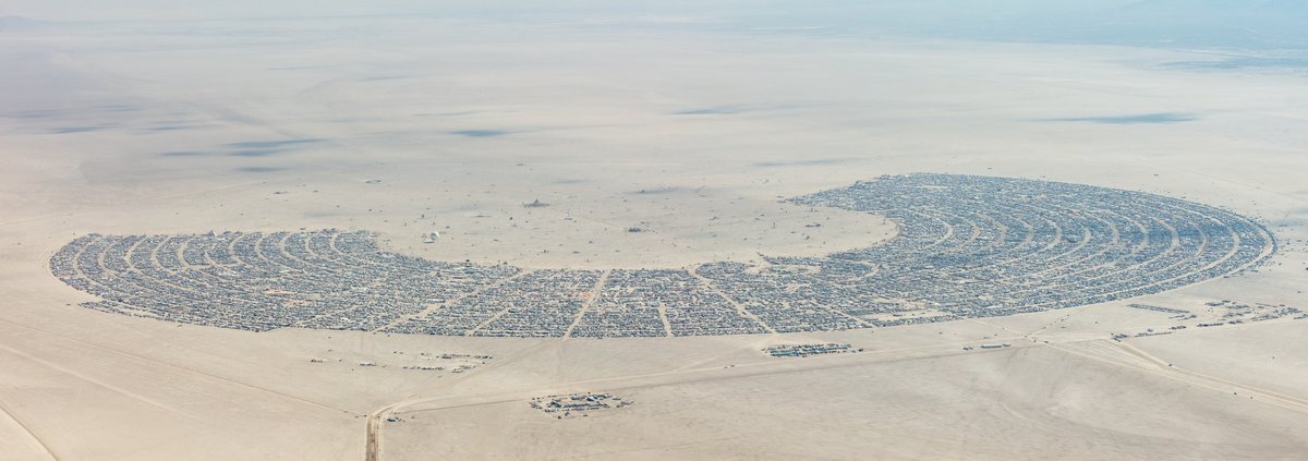 This aerial photograph of Black Rock City was shot on the morning of Friday August 31st, 2018 during Burning Man 2018. The pilot of the aircraft was Purple Haze.
