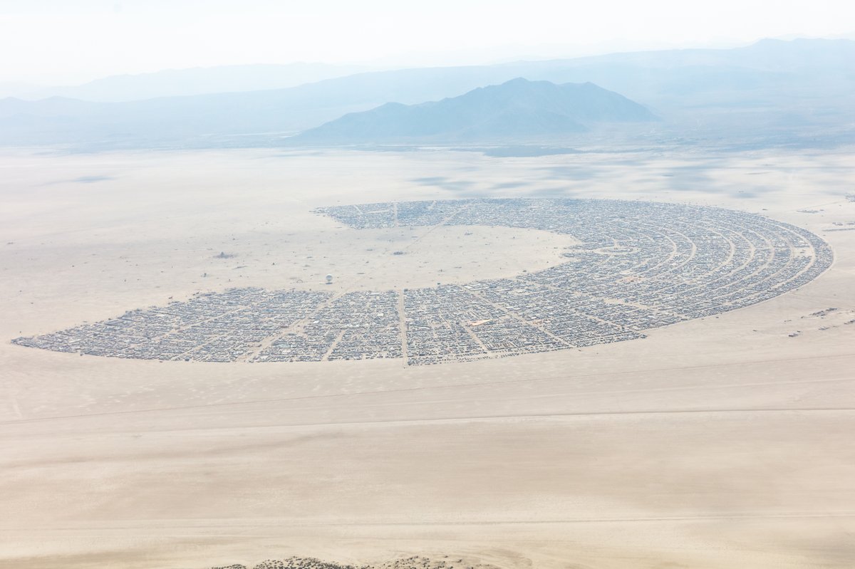 This aerial photograph of Black Rock City was shot on the morning of Friday August 31st, 2018 during Burning Man 2018. The pilot of the aircraft was Purple Haze.