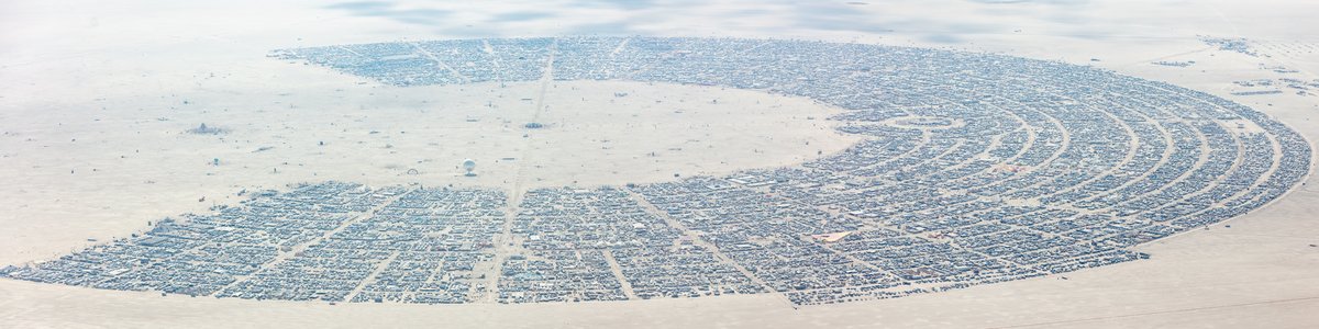 This aerial photograph of Black Rock City was shot on the morning of Friday August 31st, 2018 during Burning Man 2018. The pilot of the aircraft was Purple Haze.