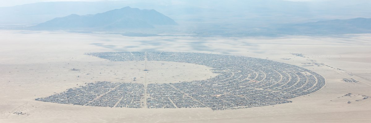 This aerial photograph of Black Rock City was shot on the morning of Friday August 31st, 2018 during Burning Man 2018. The pilot of the aircraft was Purple Haze.