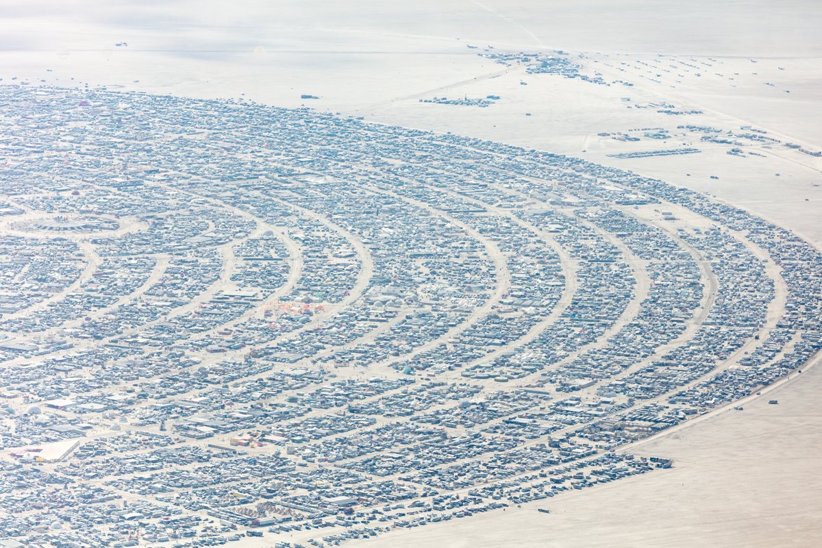 This aerial photograph of Black Rock City was shot on the morning of Friday August 31st, 2018 during Burning Man 2018. The pilot of the aircraft was Purple Haze.