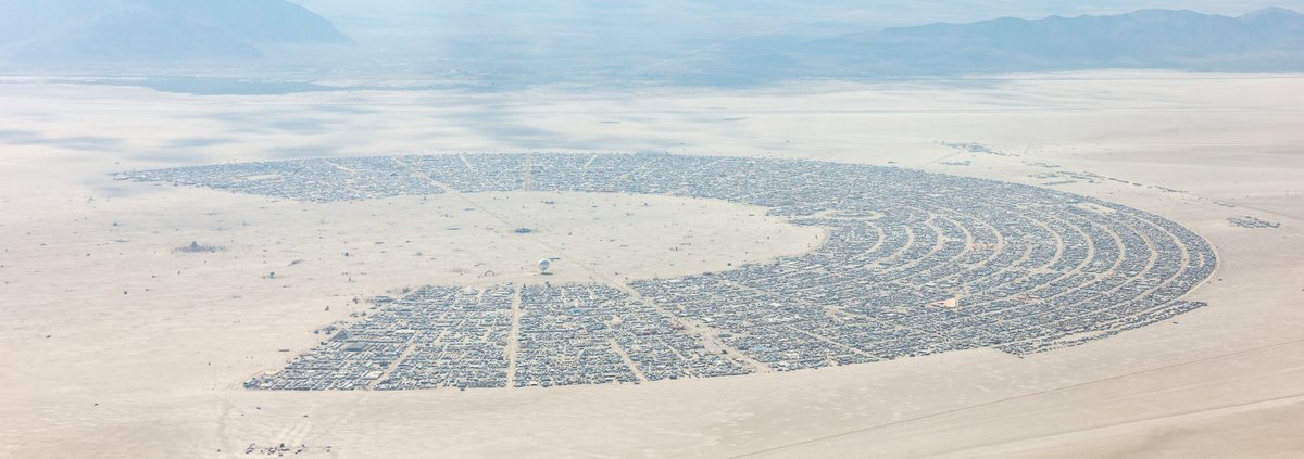 This aerial photograph of Black Rock City was shot on the morning of Friday August 31st, 2018 during Burning Man 2018. The pilot of the aircraft was Purple Haze.