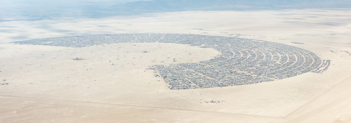 This aerial photograph of Black Rock City was shot on the morning of Friday August 31st, 2018 during Burning Man 2018. The pilot of the aircraft was Purple Haze.