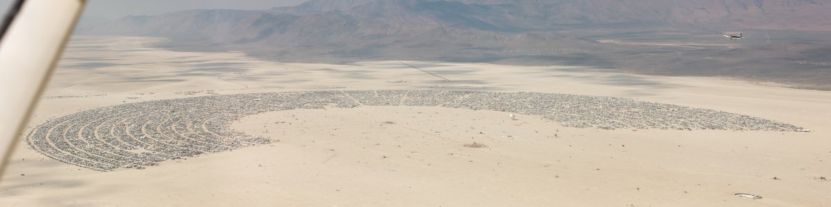This aerial photograph of Black Rock City was shot on the morning of Friday August 31st, 2018 during Burning Man 2018. The pilot of the aircraft was Purple Haze.