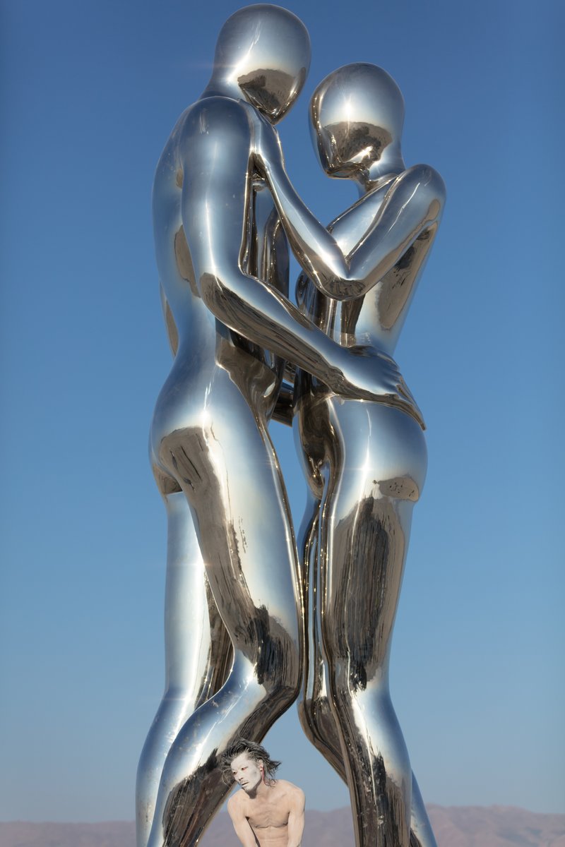 In Every Lifetime I Will Find You by: Michael Benisty, Love and Unity from: Brooklyn, NY year: 2018 A sculptural representation of Male and Female holding one another in a symbolic and universal position of caring in a display of Love and Unity. Measuring 25 feet tall and made out of mirror polished stainless steel.