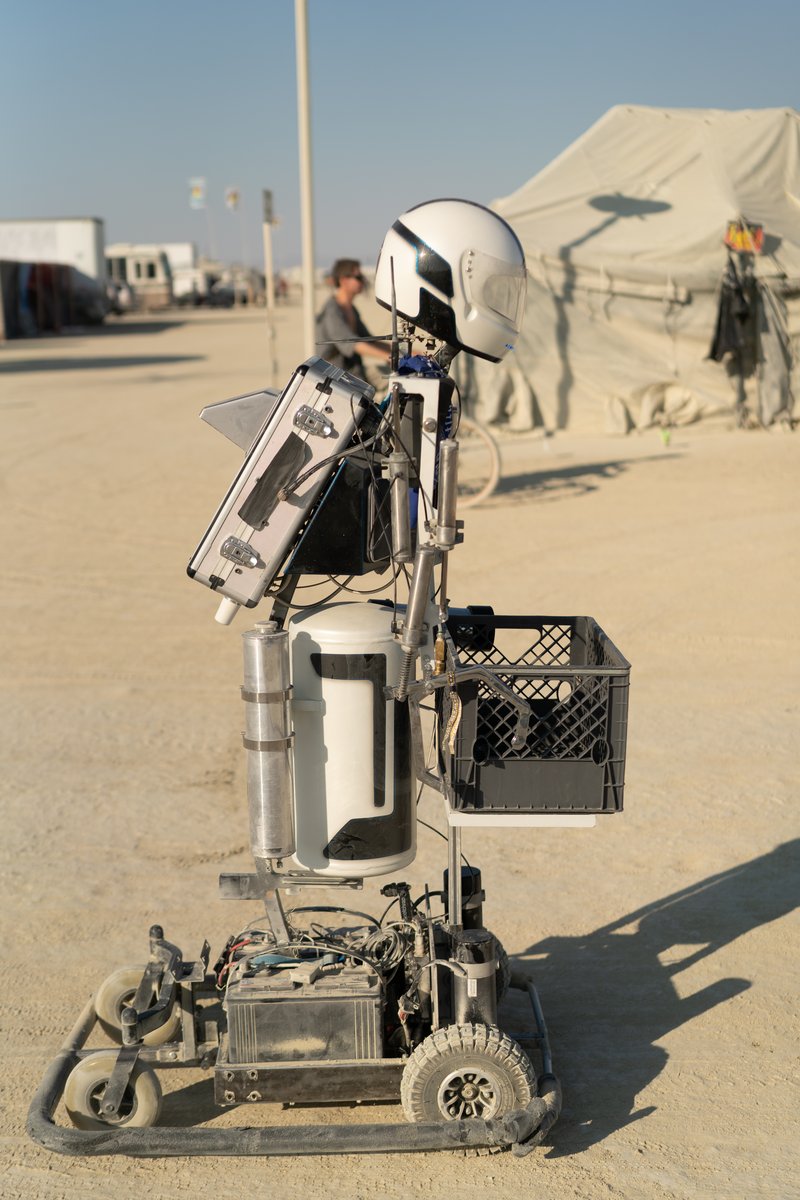Hotshot The Robot was unquestionably one of my favorite things at Burning Man 2018. It's head moves around, it talks to you, and it moves around interacting with Burners and other robots! URL: http://hotshottherobot.com/