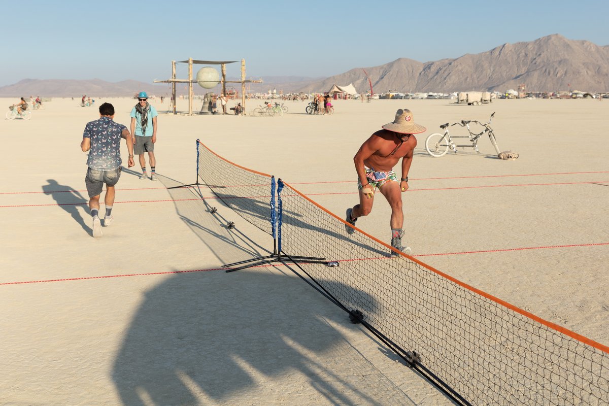 Someone setup a nice little tennis court on the playa. These guys just automatically started being the ball boys. Their technique was inpecable and hilarious. You don't watch Burning Man like a festival with performances on stage, at Burning Man everyone is on the stage and we all built the stage.