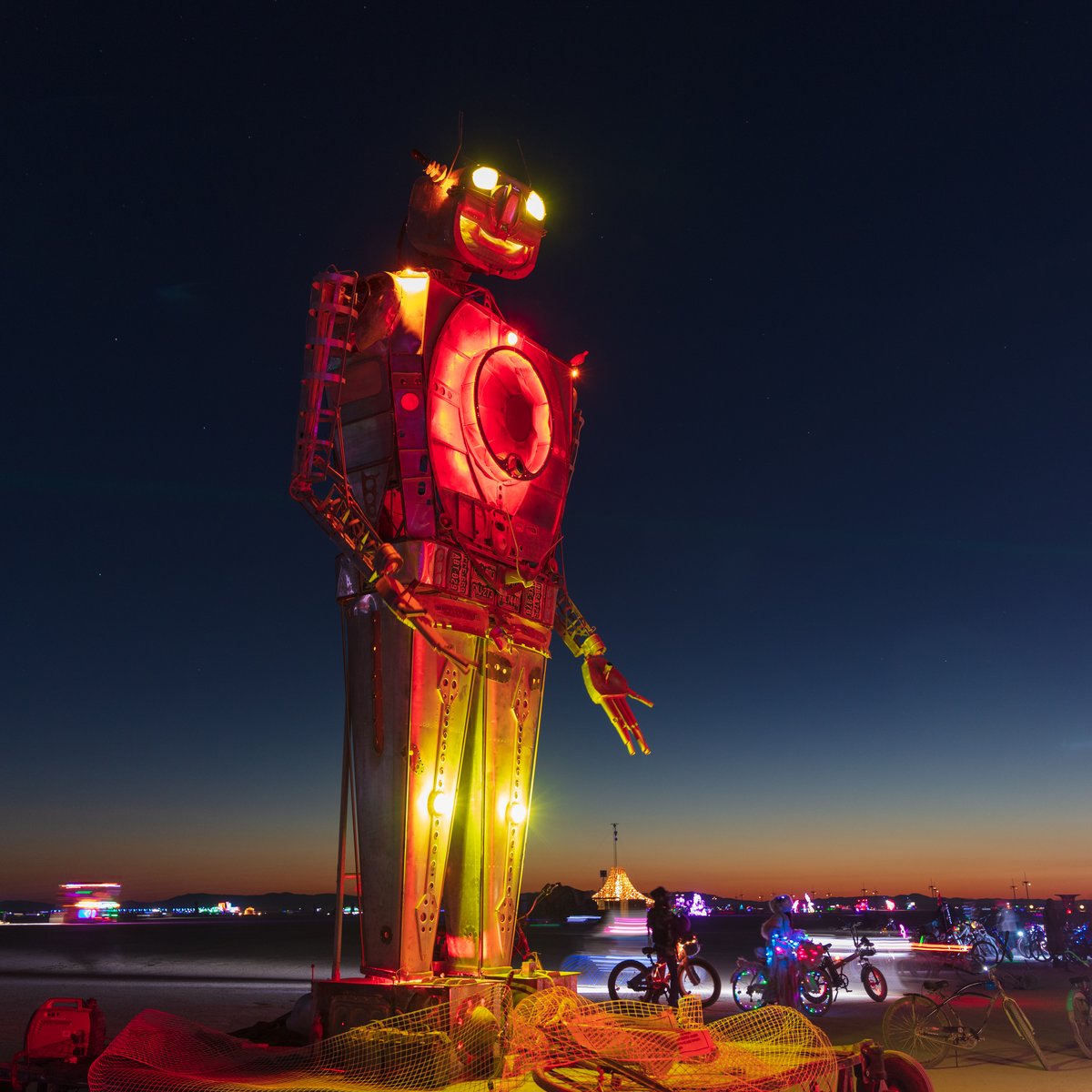Robot Resurrection by: Shane Evans from: Denver, CO year: 2018 Robot Resurrection is towering 30 foot tall, human piloted, articulating sculpture made from reclaimed airplane parts and found objects. From the torso cockpit, the operator(s) manipulate the Robot's motions and fire effects. This piece is a representation of we all have become... Robots. It is a wake-up call of how large these problems are. We have been controlled for too long. Robot Resurrection was born from what we as a society have discarded. Our hope is that this 28′ Robot will inspire reflection upon one's self and be a reminder of the power we all hold. We hope it awakens some awareness of our situation and encourages some small change on a small scale that leads to big change in the massive system.