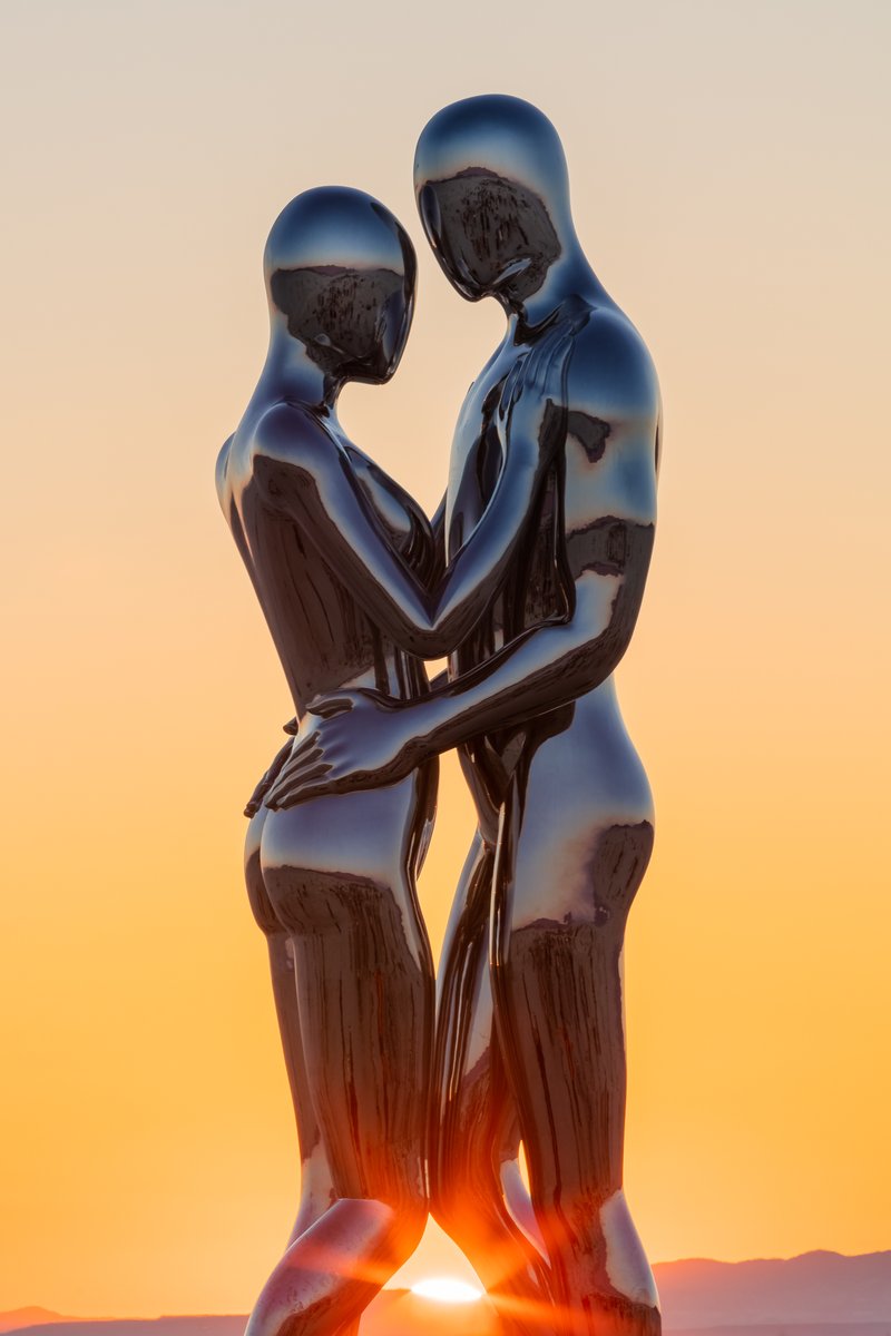 In Every Lifetime I Will Find You by: Michael Benisty, Love and Unity from: Brooklyn, NY year: 2018 A sculptural representation of Male and Female holding one another in a symbolic and universal position of caring in a display of Love and Unity. Measuring 25 feet tall and made out of mirror polished stainless steel.