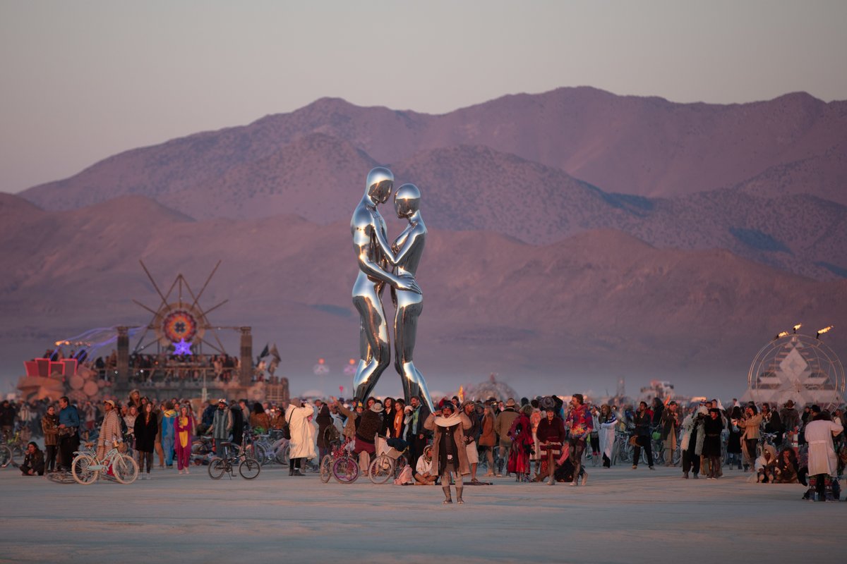 In Every Lifetime I Will Find You by: Michael Benisty, Love and Unity from: Brooklyn, NY year: 2018 A sculptural representation of Male and Female holding one another in a symbolic and universal position of caring in a display of Love and Unity. Measuring 25 feet tall and made out of mirror polished stainless steel.