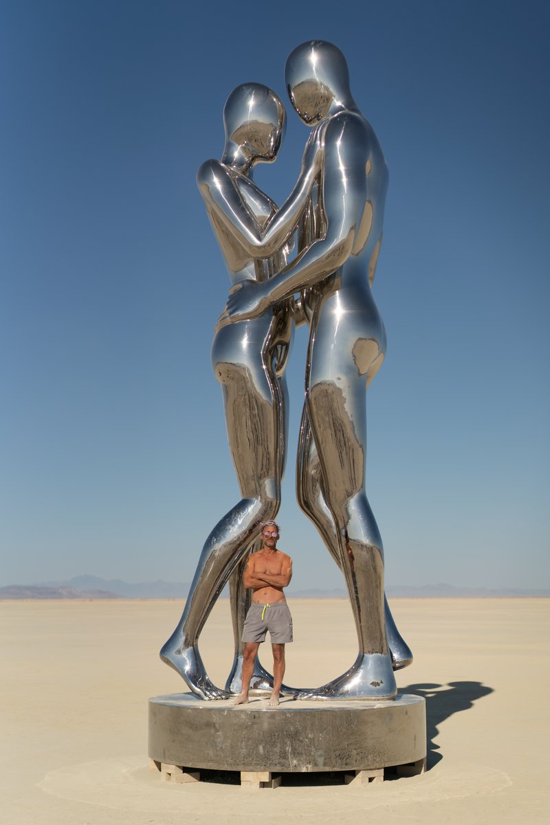 In Every Lifetime I Will Find You by: Michael Benisty, Love and Unity from: Brooklyn, NY year: 2018 A sculptural representation of Male and Female holding one another in a symbolic and universal position of caring in a display of Love and Unity. Measuring 25 feet tall and made out of mirror polished stainless steel.