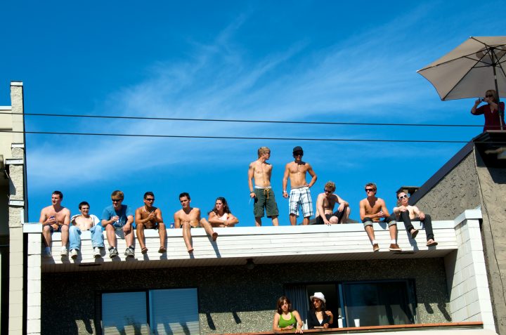 Spectators On Top Of Building