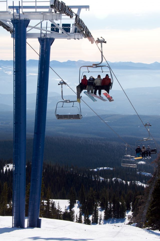 Snowboarders On Chairlift