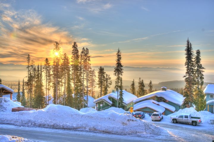 big white chalet at sunset