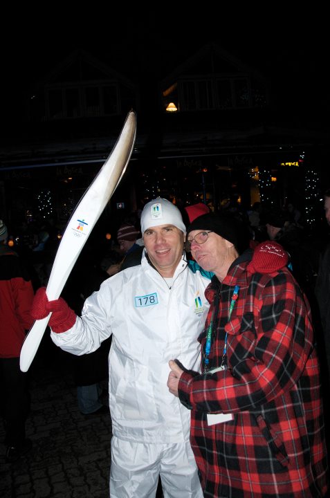 Torchbearer Poses for Photo with Fan