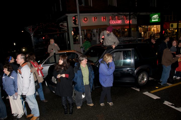 Crowd Awaits the Torch in front of Sophies Restaurant