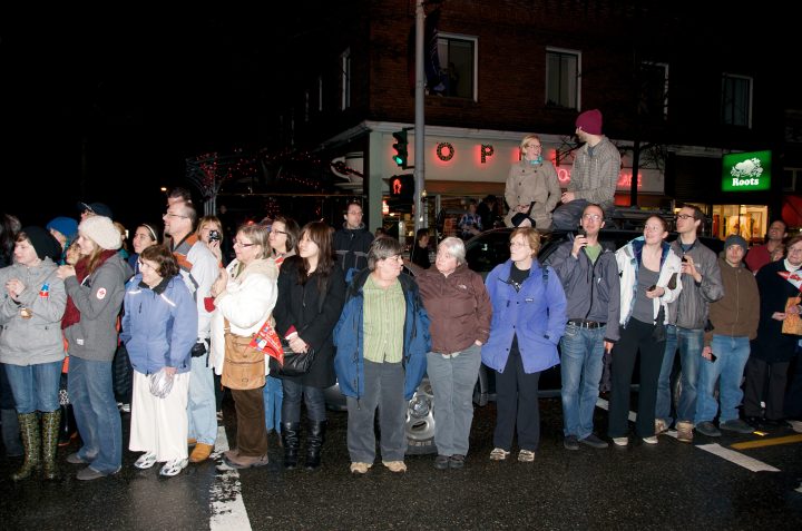 Crowd Awaits the Torch in front of Sophies Restaurant