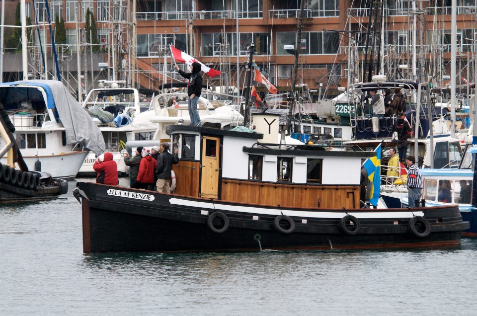 Tub Boat Awaits the Arrival of the Torch