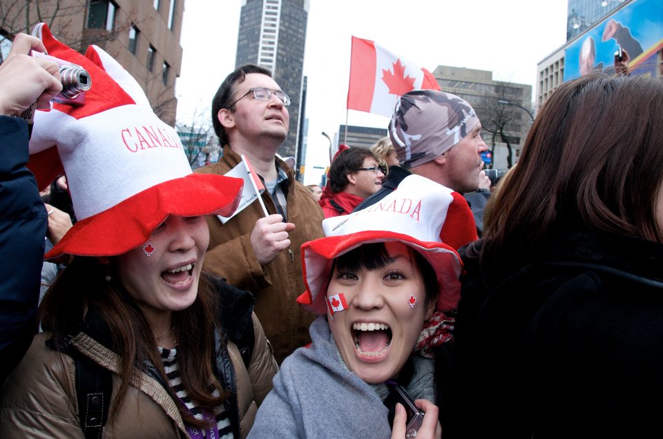 Couple of Ladies Cheer on the Torch