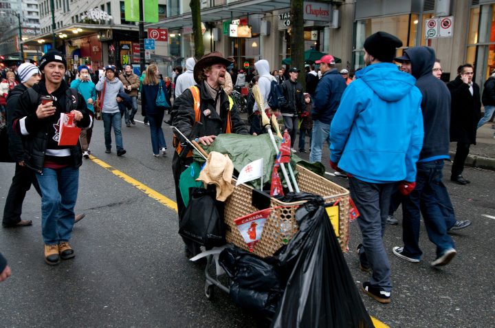 Homeless Man Heckling Small Group of Protestors