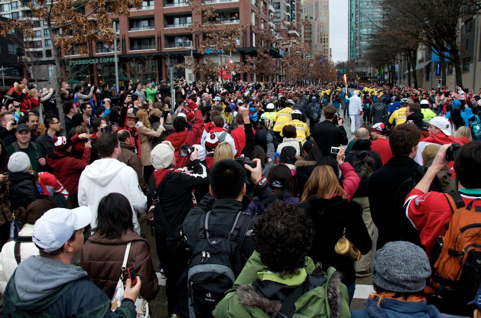 Crowd Follows the Torch Into Downtown