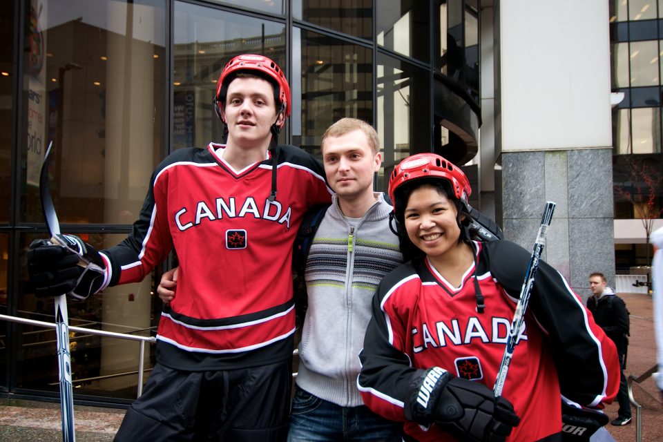 Hockey Players Pose With Dude