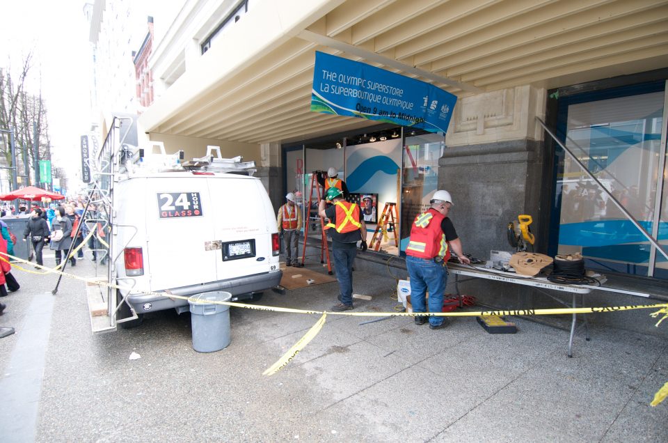 Workers Repair Broken Windows From Day 2 Protests