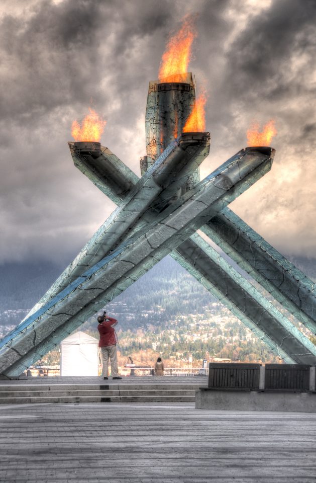 Man Photographing the Olympic Cauldron