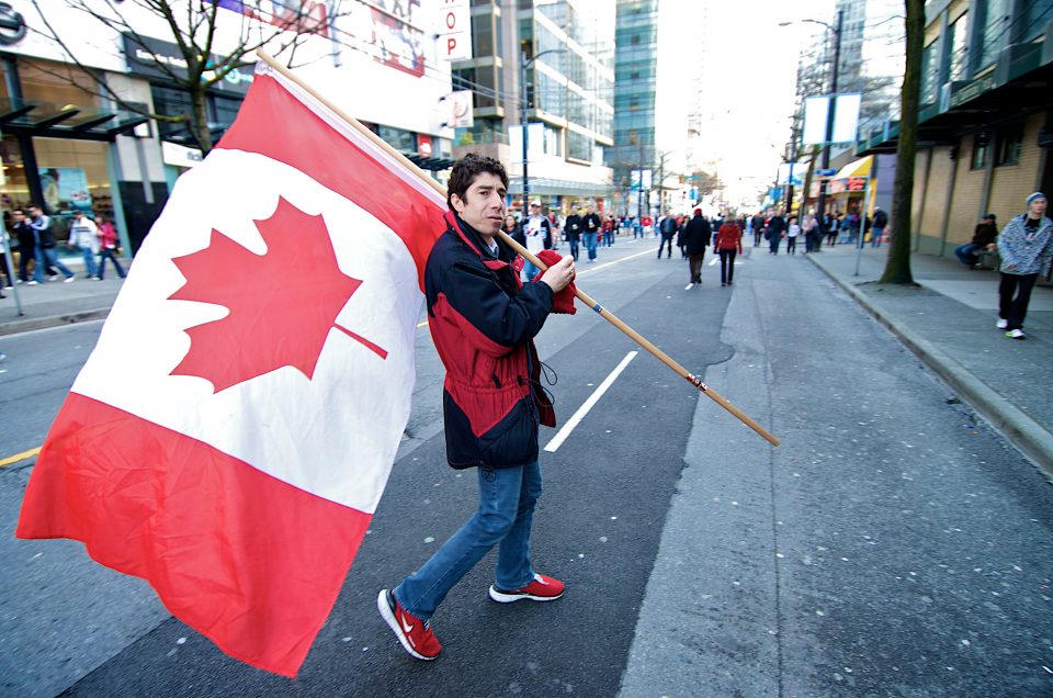 Man Carrying Canadian Flag