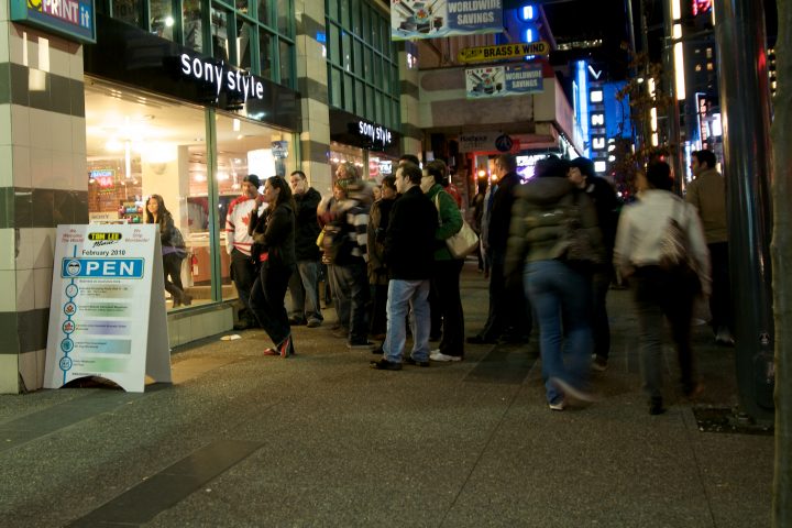 People Gathered Around to Watch Team Canada vs Norway