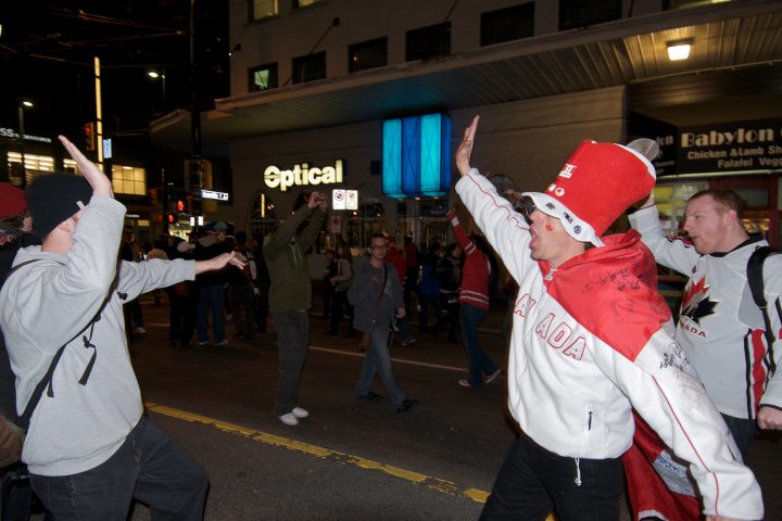 Strangers High Five in the Streets