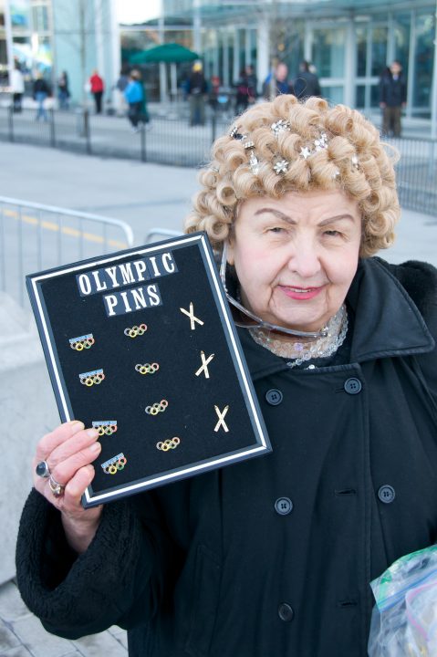 Old Lady Selling Olympic Pins