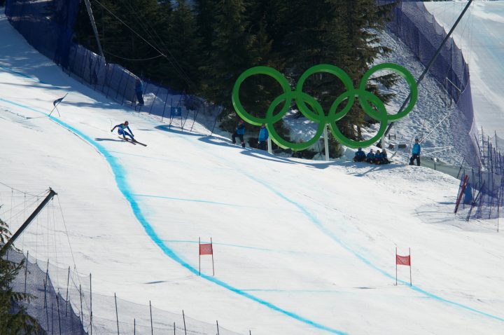 Skiier Charges Through a Gate