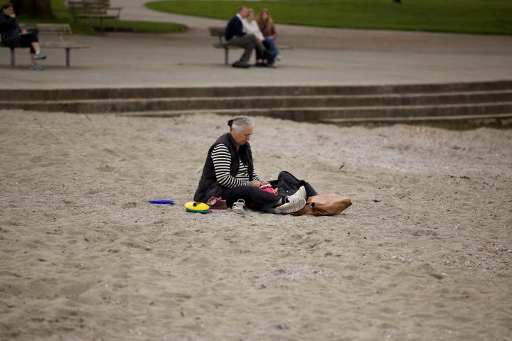 Granny Plays with her iPhone at the Beach