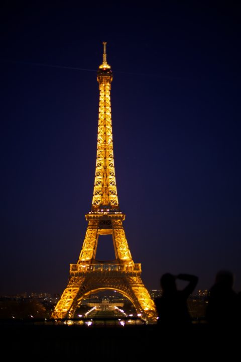 Photographer and The Eiffel Tower at Night