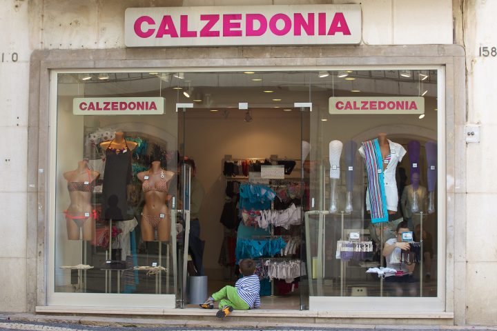Kid in Swimsuit Shop