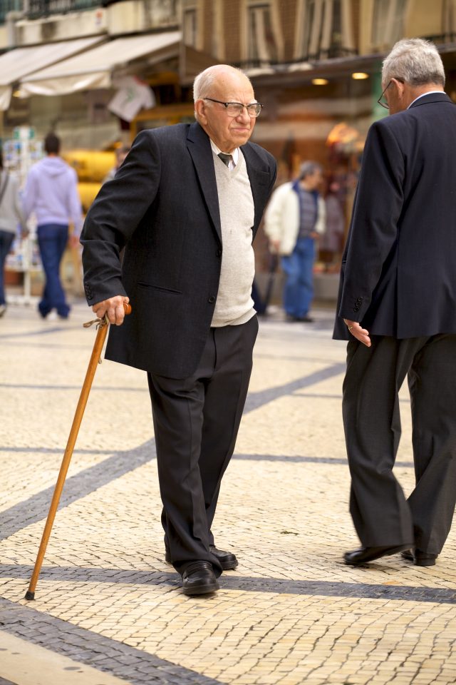 Old Man Walking with Cane